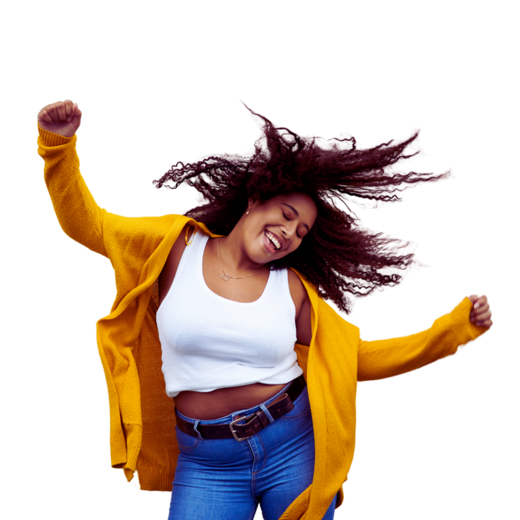 woman dancing with yellow sweater and blue jeans and a big smile